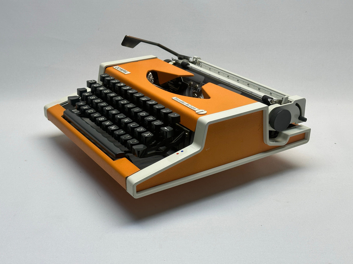 Orange Olympia Typewriter with Black Keyboard, White Bag - 1960 Model