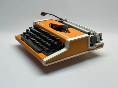 Orange Olympia Typewriter with Black Keyboard, White Bag - 1960 Model