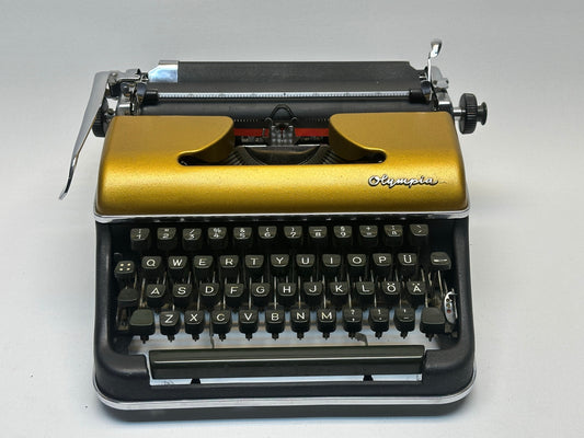 Great gift! Olympia SM3 Gold Typewriter - Luxurious Elegance for Your Workspace