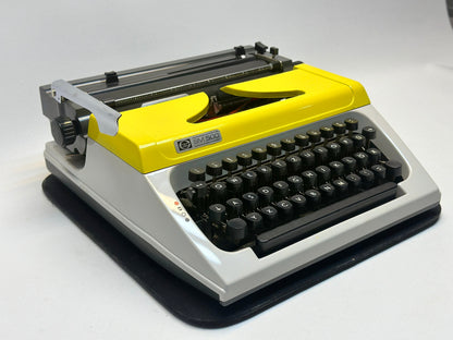 Capture Timeless Elegance with the Yellow Cover White Typewriter - SM500 Model, Black Keyboard, Antique Gift