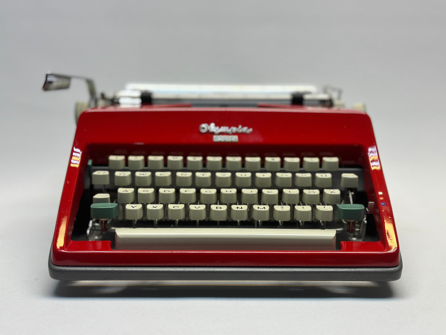 Experience Vintage Elegance with the Olympia Monica Red Typewriter - QWERTZ White Keyboard, Antique 1960 Model
