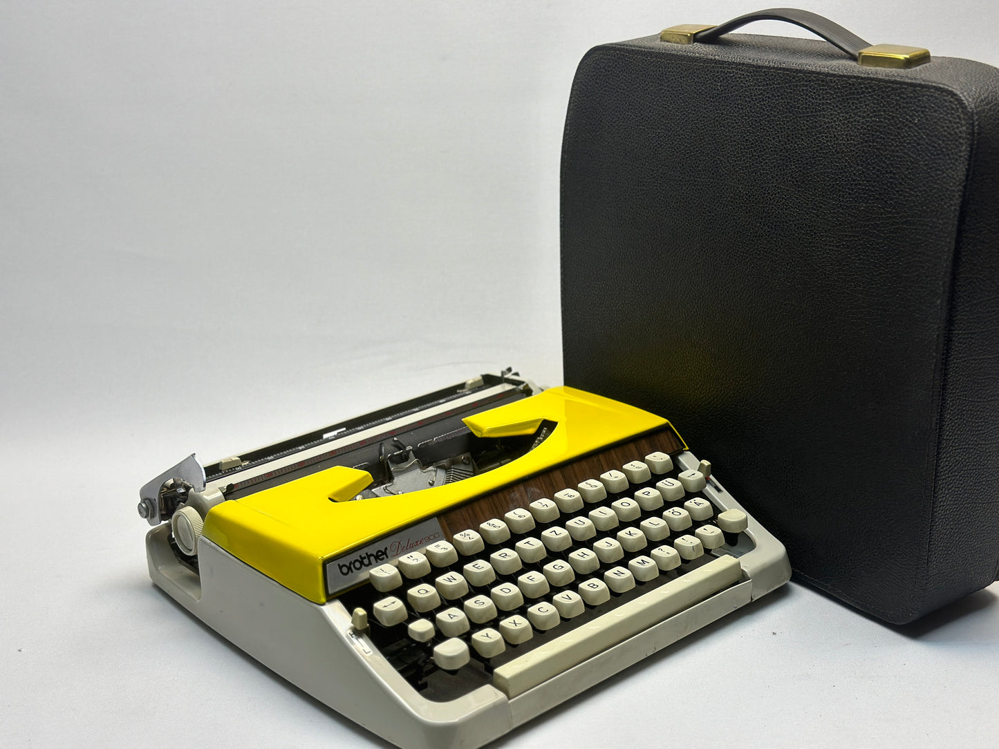 Discover Vintage Splendor with the Yellow Olympia Deluxe Typewriter - German-Made, Antique Treasure