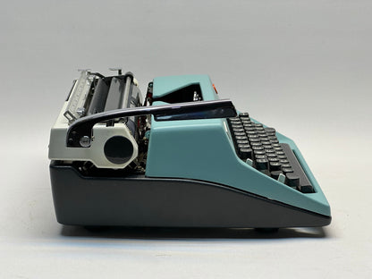 Olympia Monica Typewriter - QWERTZ Keyboard, Black Keys, Matte Blue Finish, Leather Bag