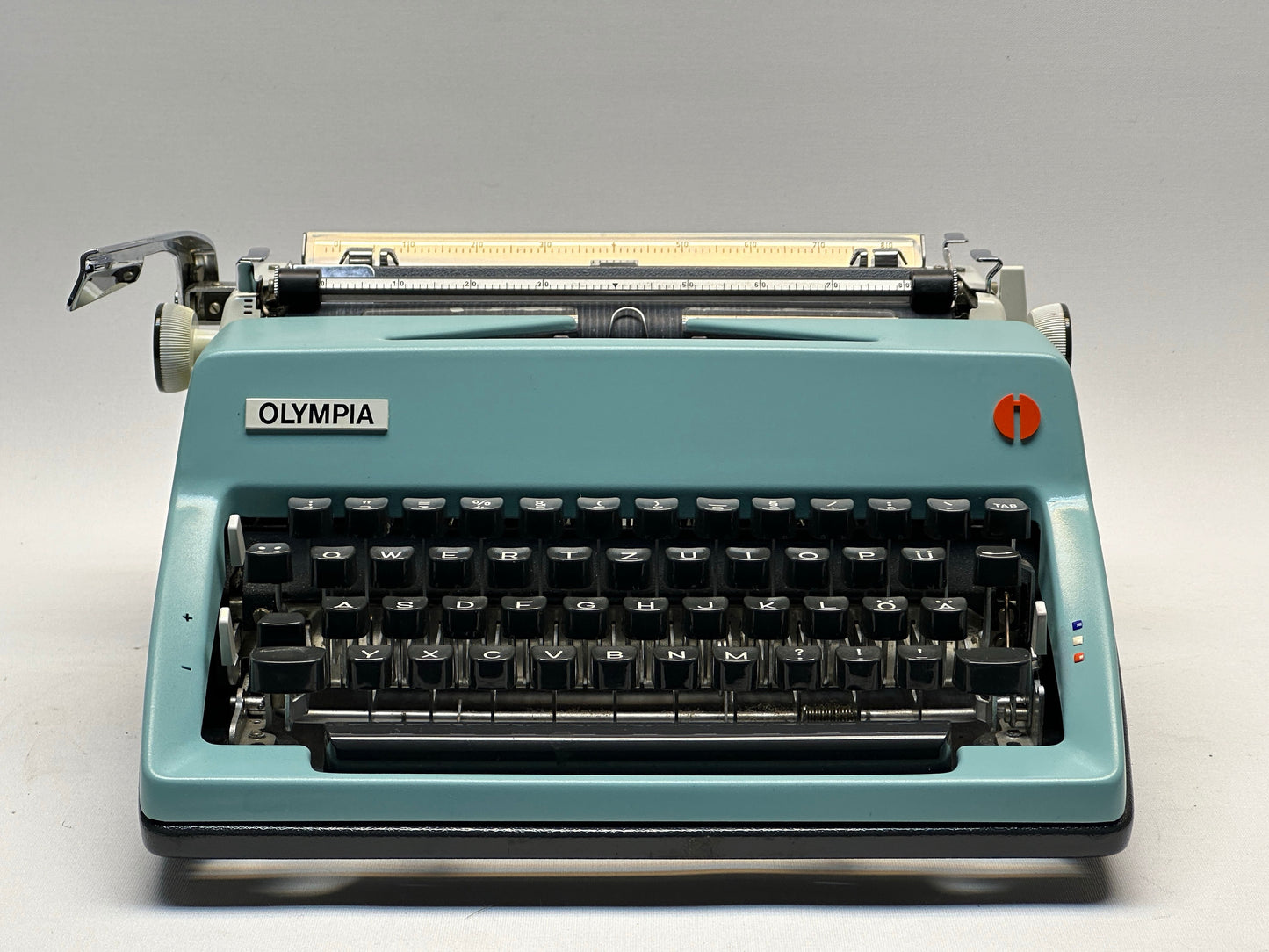 Olympia Monica Typewriter - QWERTZ Keyboard, Black Keys, Matte Blue Finish, Leather Bag