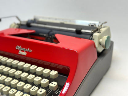 Experience Vintage Elegance with the Olympia Monica Red Typewriter - QWERTZ White Keyboard, Antique 1960 Model